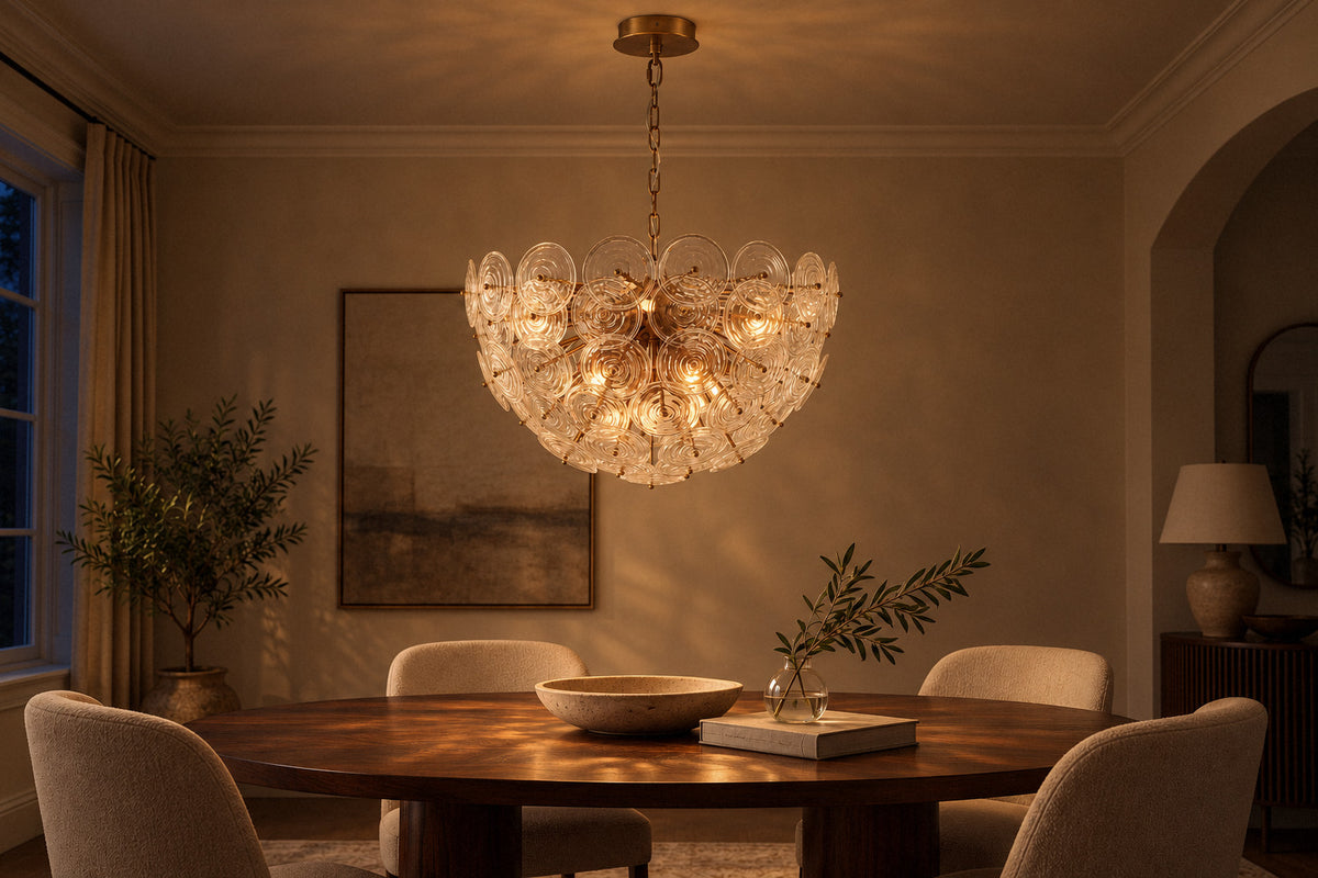 Loliis Bowl Disc glass chandelier in a dining room at night, lit (AI-generated scene)