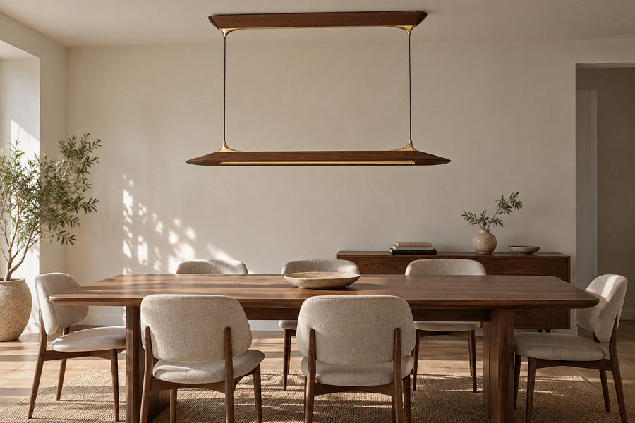 Mernoe walnut and brass chandelier in a dining room by day, switched off (AI-generated scene)