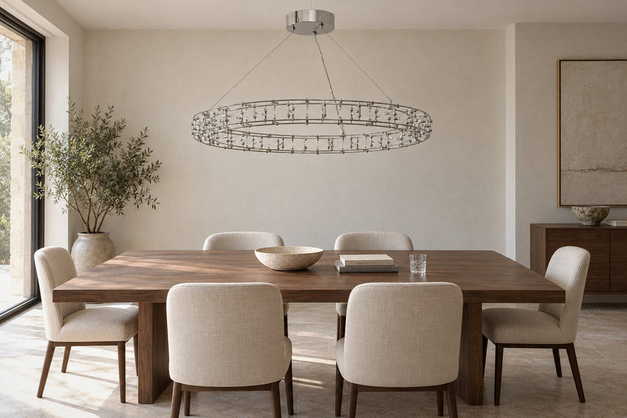 Nomena Orbital Halo nickel chandelier in a dining room by day, switched off (AI-generated scene)