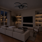 Plafonnier LED noir 7 anneaux Ø110 cm éteint, salon le soir