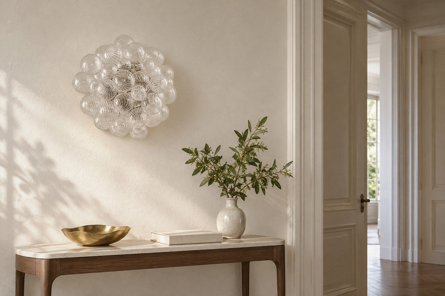 Vavais Globe Bubble glass wall sconce in a hallway by day, switched off (AI-generated scene)
