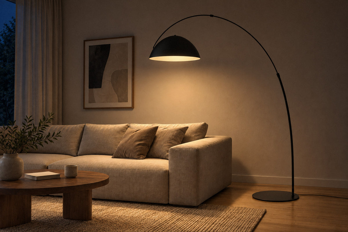 Verse Arc Floor Lamp black metal floor lamp in a living room at night, lit (AI-generated scene)